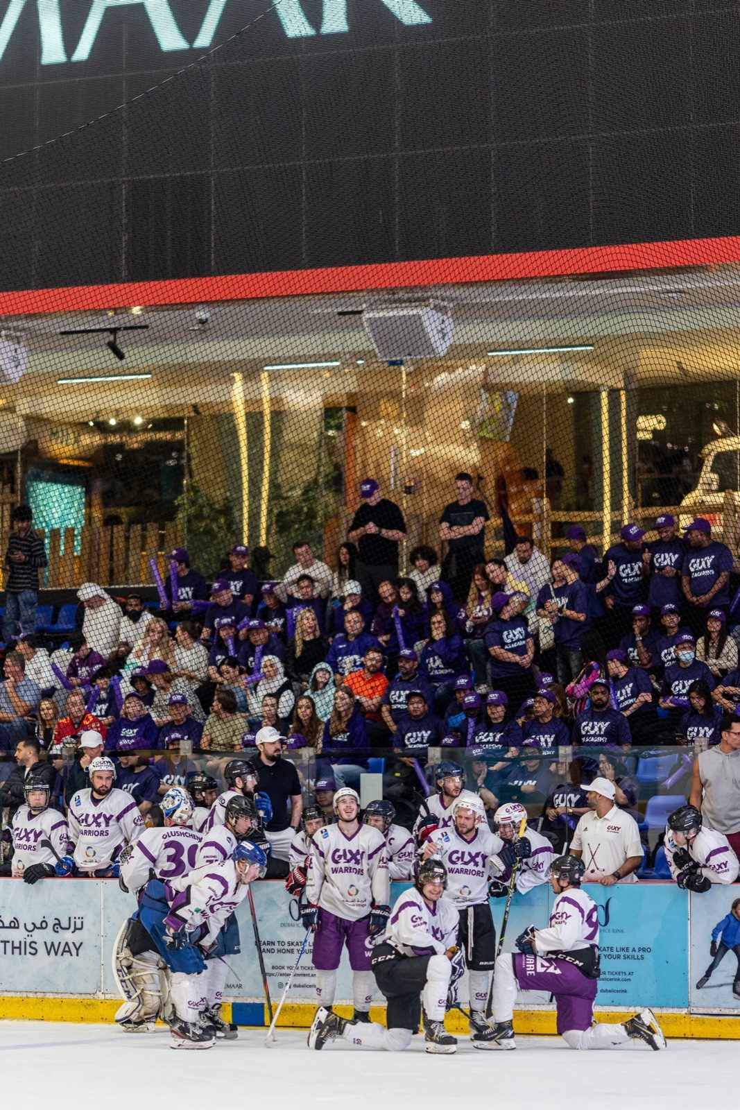 Galaxy Warriors on the ice at Dubai Ice Rink with a full stand behind them